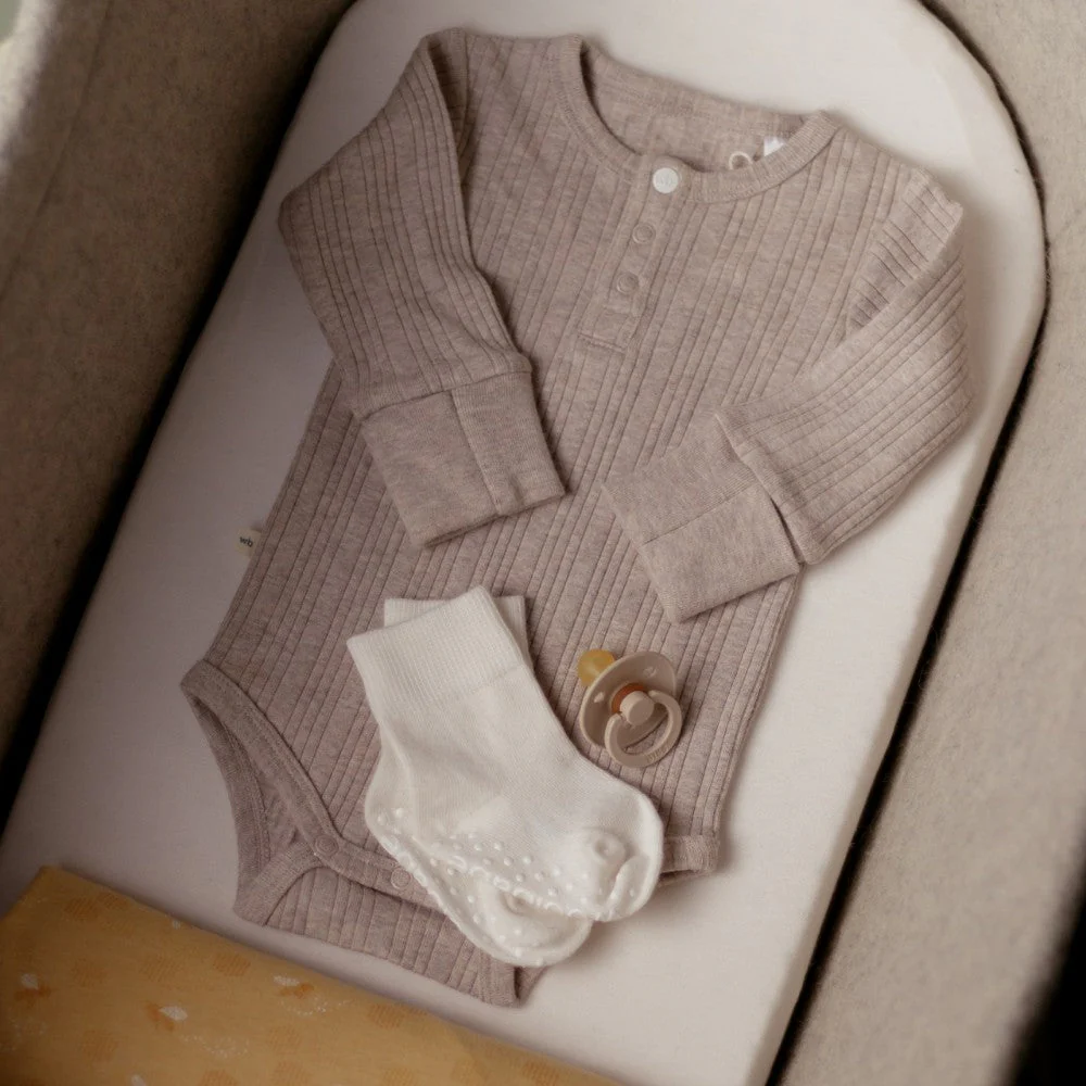 Woolbabe Organic Cotton/Merino Long Sleeve Henley Bodysuit Dune Marl - Image 5