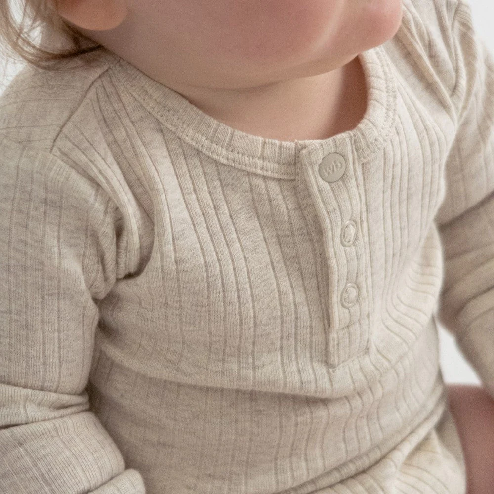 Woolbabe Organic Cotton/Merino Long Sleeve Henley Bodysuit Natural Marl - Image 3