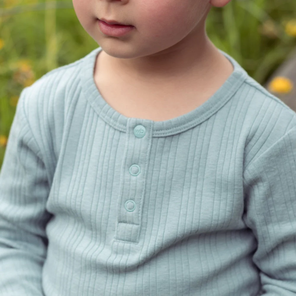 Woolbabe Organic Cotton/Merino Long Sleeve Henley Bodysuit Tide Marl - Image 4
