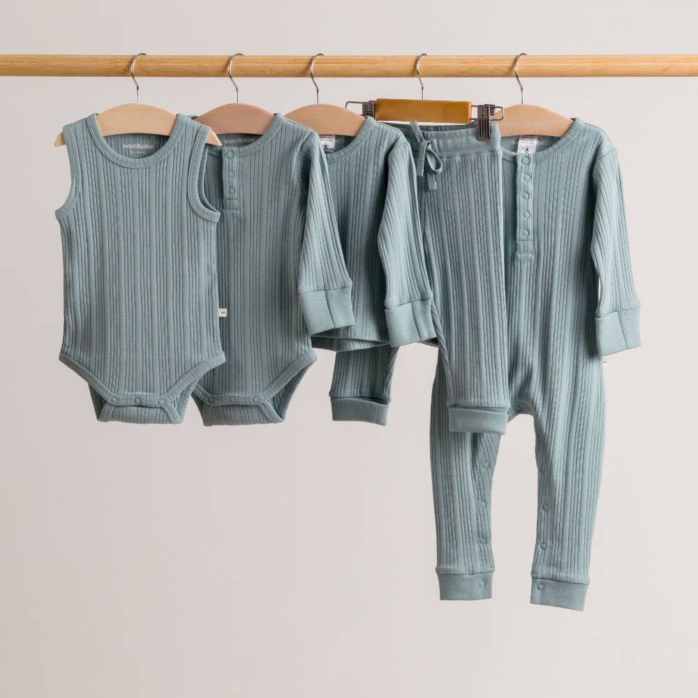 Woolbabe Organic Cotton/Merino Long Sleeve Henley Bodysuit Tide Marl - Image 5